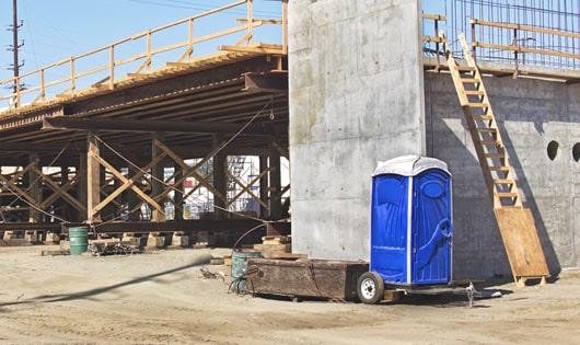 a necessary and important addition to any work site - porta potties for workers' comfort